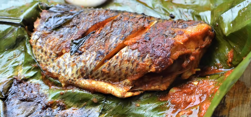 Fish cooked on tandoori by wrapping the banana leaf to enhance the flavours