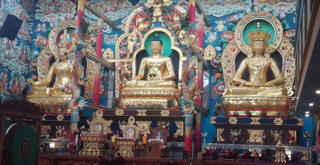 Golden statues of Buddha in Bylakuppe